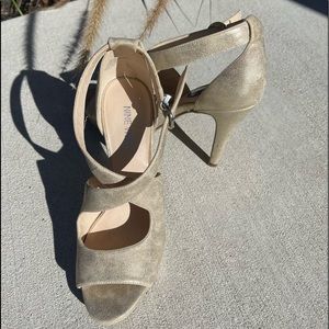 Size 7 Nine West brand, Gold high heels with ankle buckle strap, never worn.